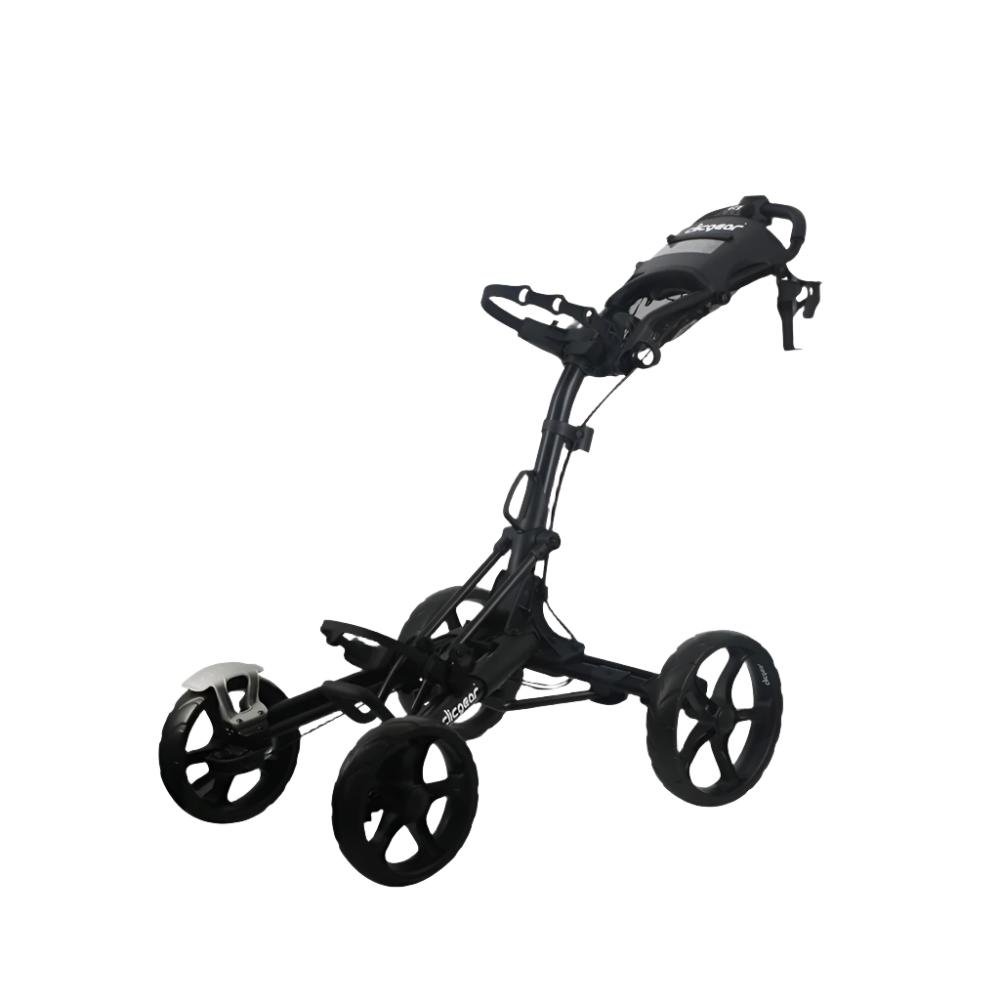 A black Clicgear golf cart with four wheels, featuring a silicone strap system and a front brake lever.