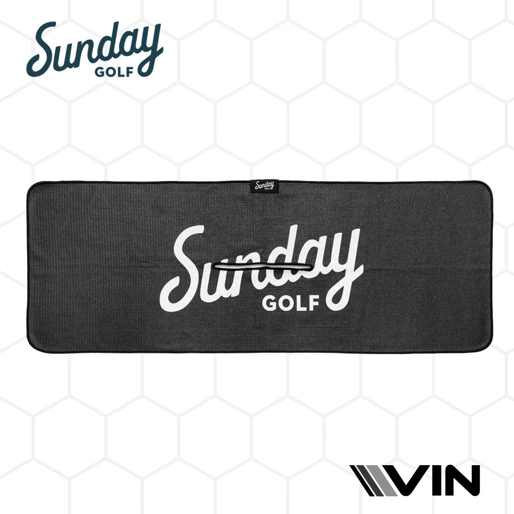 Golf towels with 'Sunday Golf' branding and a honeycomb pattern in the background. The towels are black with white and gray text and design elements.