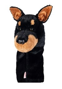 Golf club headcover designed to resemble a dog's head, primarily black with brown ears and a brown muzzle.