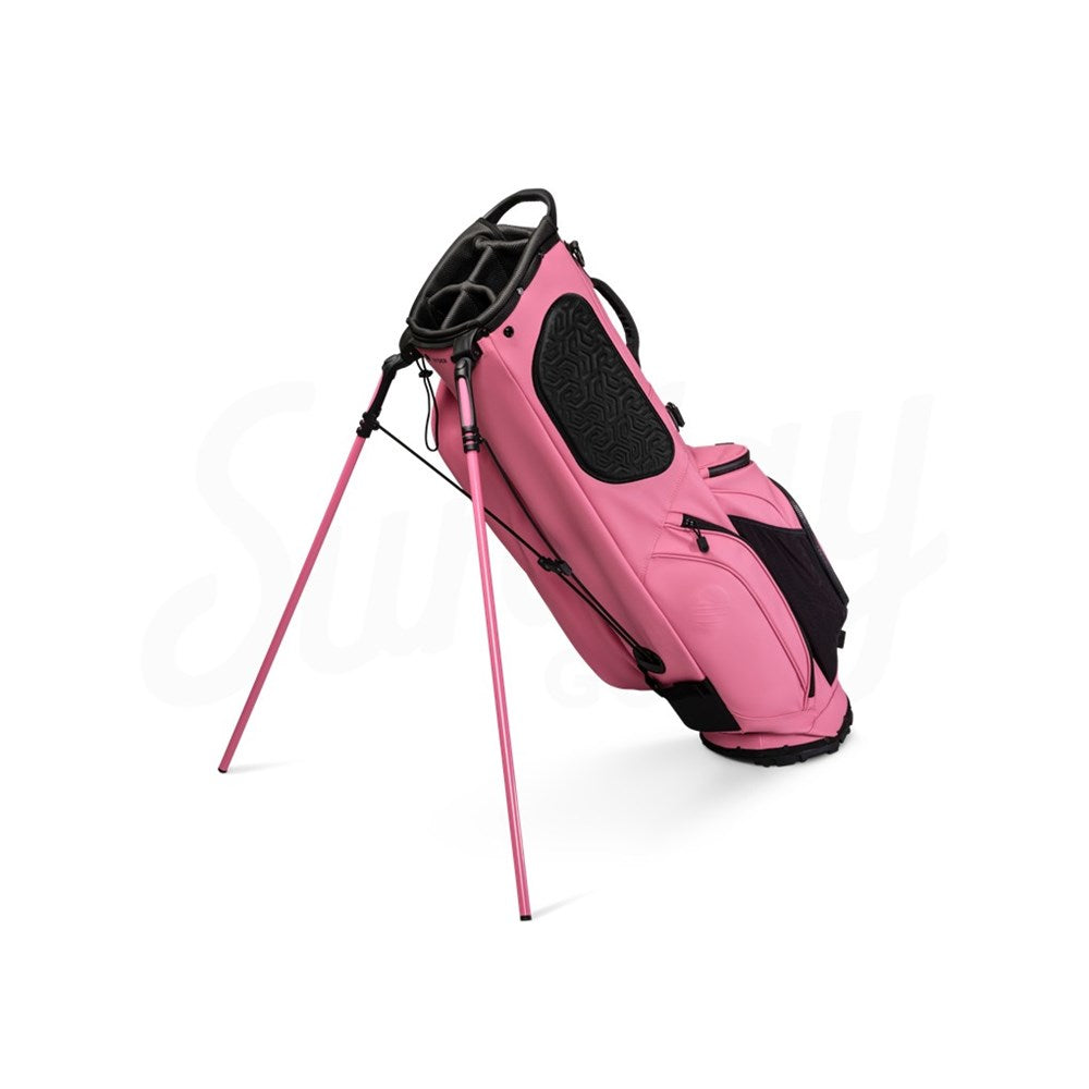 Pink golf bag with black accents on a white background
