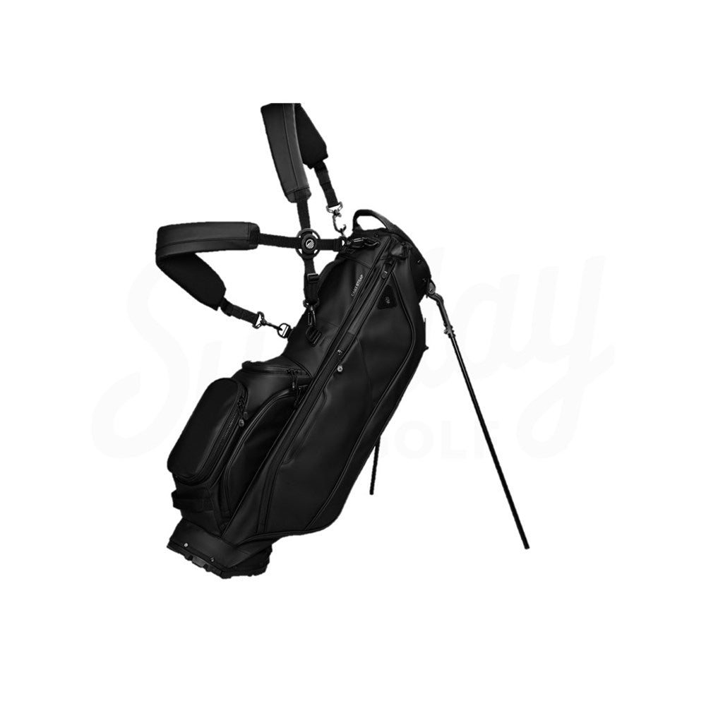 Black golf bag with stand on a white background