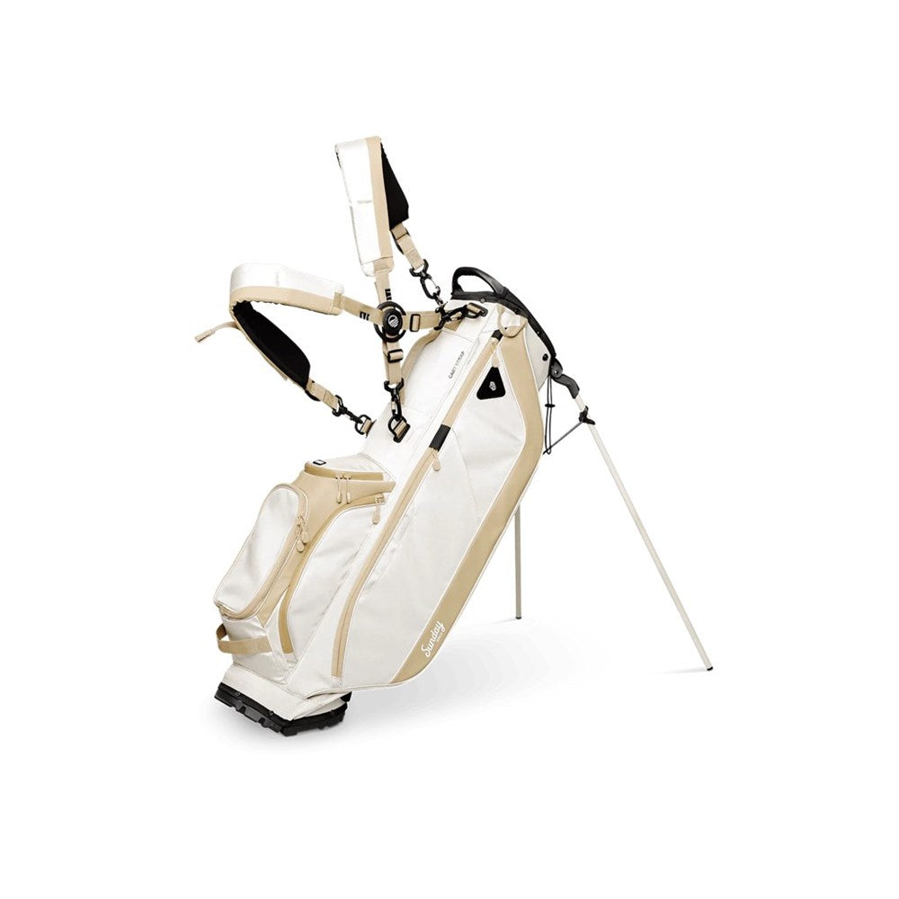White and beige golf bag with stand on a white background