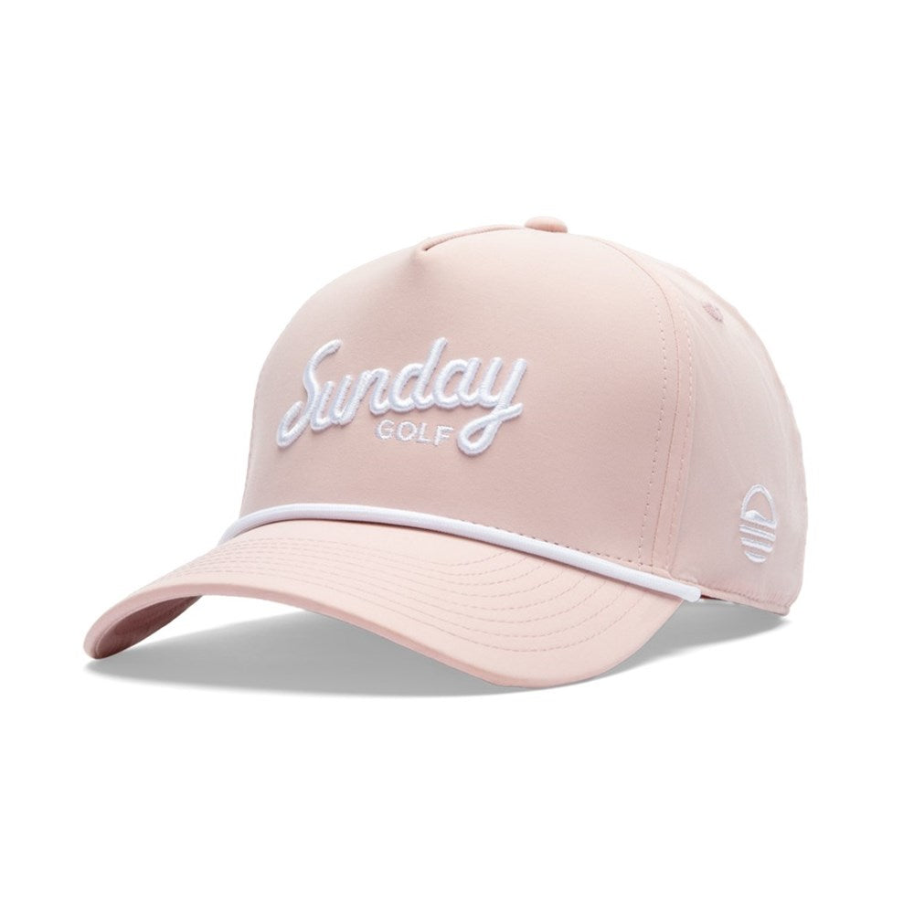 A pink golf hat with 'Sunday Golf' text on the front and a white athletic sweatband.