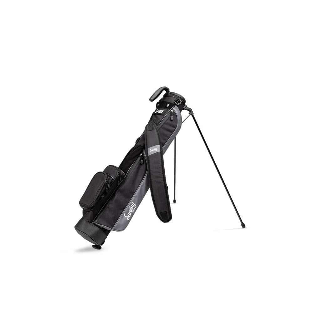 A black Sunday Golf golf bag with a stand mechanism, featuring multiple pockets and a shoulder strap.