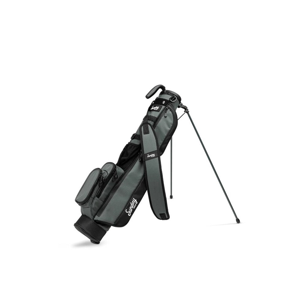 A black and gray Sunday Golf range/green side golf bag with a cushioned shoulder strap and stand feature.