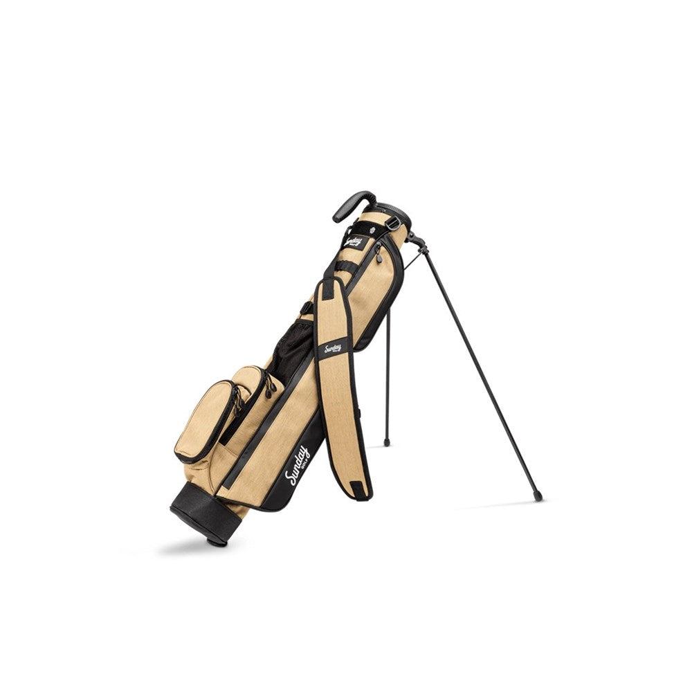 Beige and black golf bag with a golf club on a white background