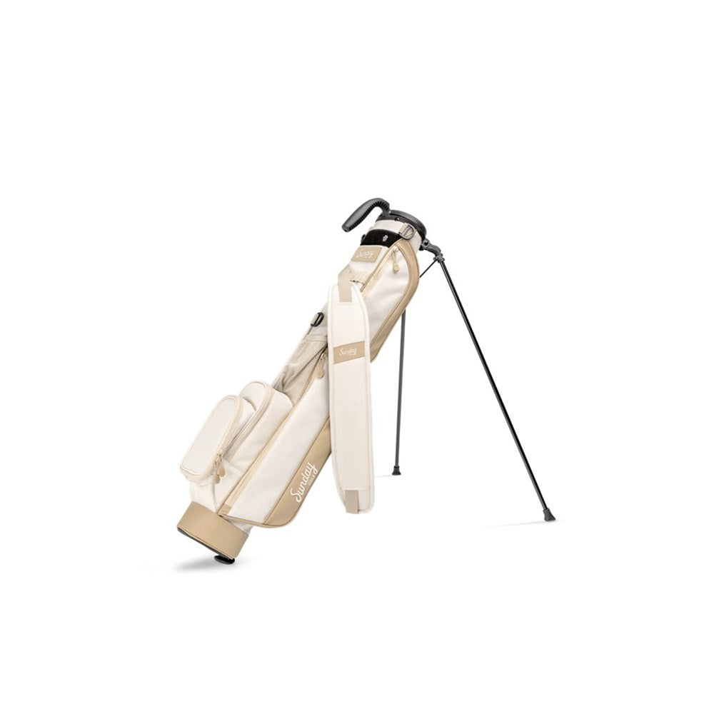 A beige and white golf bag with a black stand, designed to hold up to 6 clubs, featuring an insulated drink pouch and a cushioned shoulder strap.