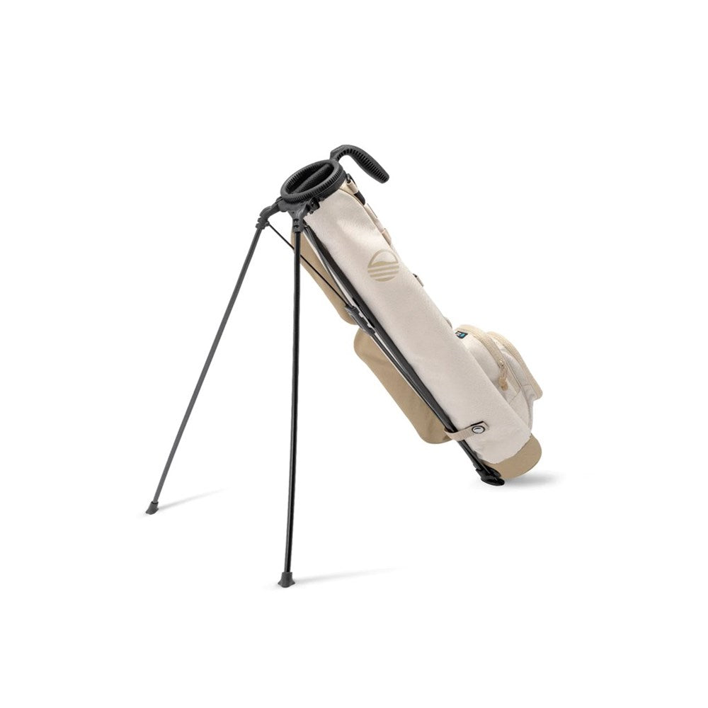 A beige and white golf bag with a black stand, designed to hold up to 6 clubs, featuring an insulated drink pouch and a cushioned shoulder strap.