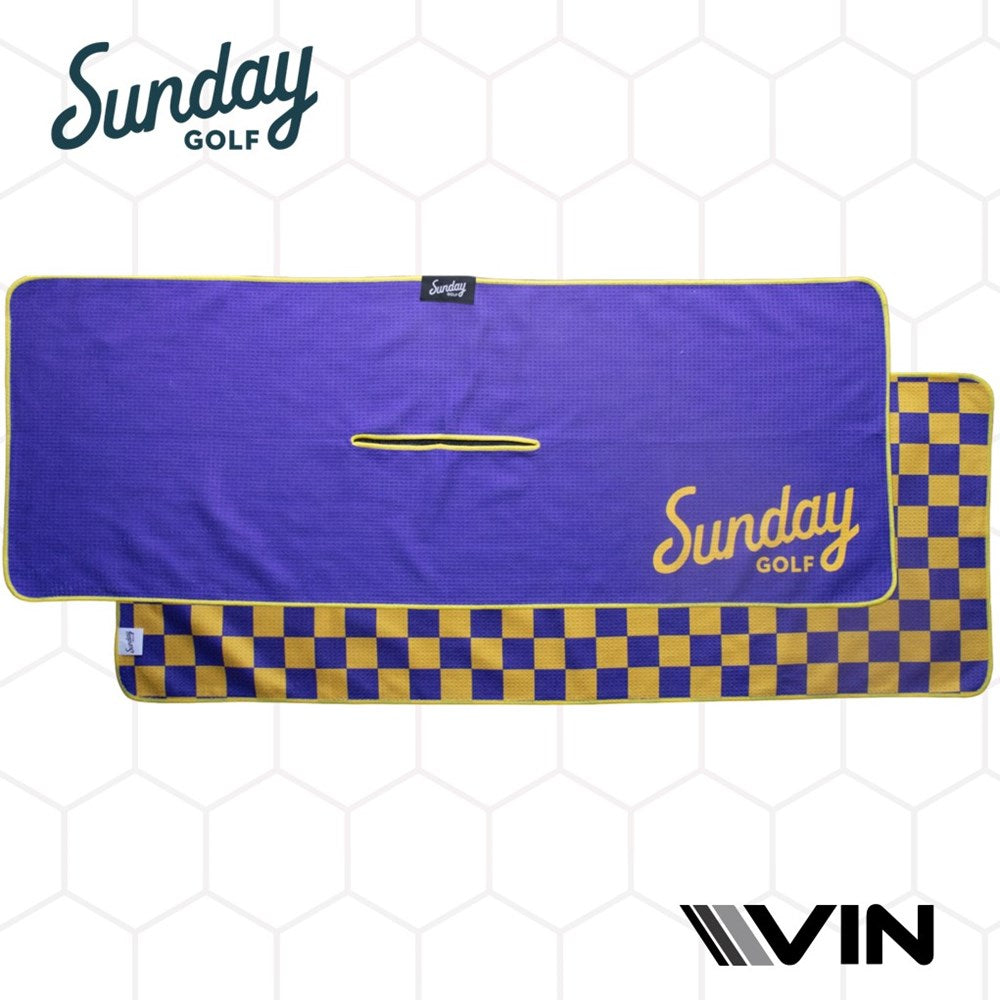 A golf towel with a checkered pattern in purple and yellow colors, featuring the 'Sunday Golf' logo.