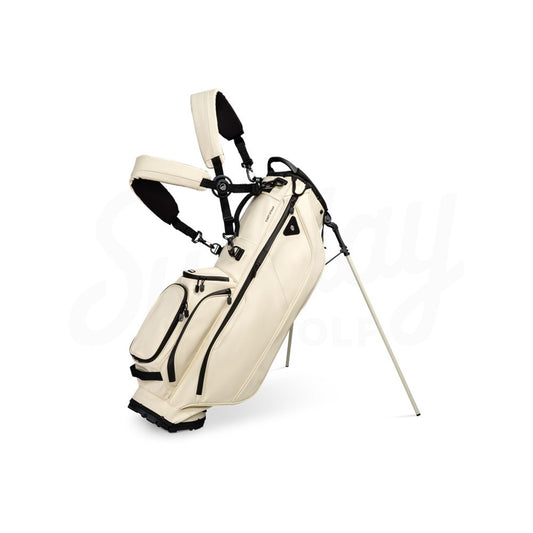 Beige golf bag with black accents on a white background